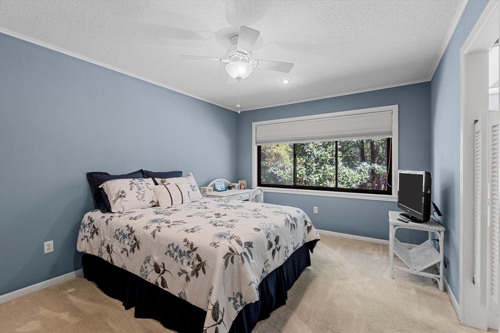 1200 North Acres Circle Springhill, LA 71075 - Photo 31 of 40 a large bed sitting in a bedroom next to a window