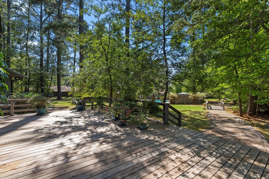 1200 North Acres Circle Springhill, LA 71075 - Photo 37 of 40 a view of a bench in a backyard
