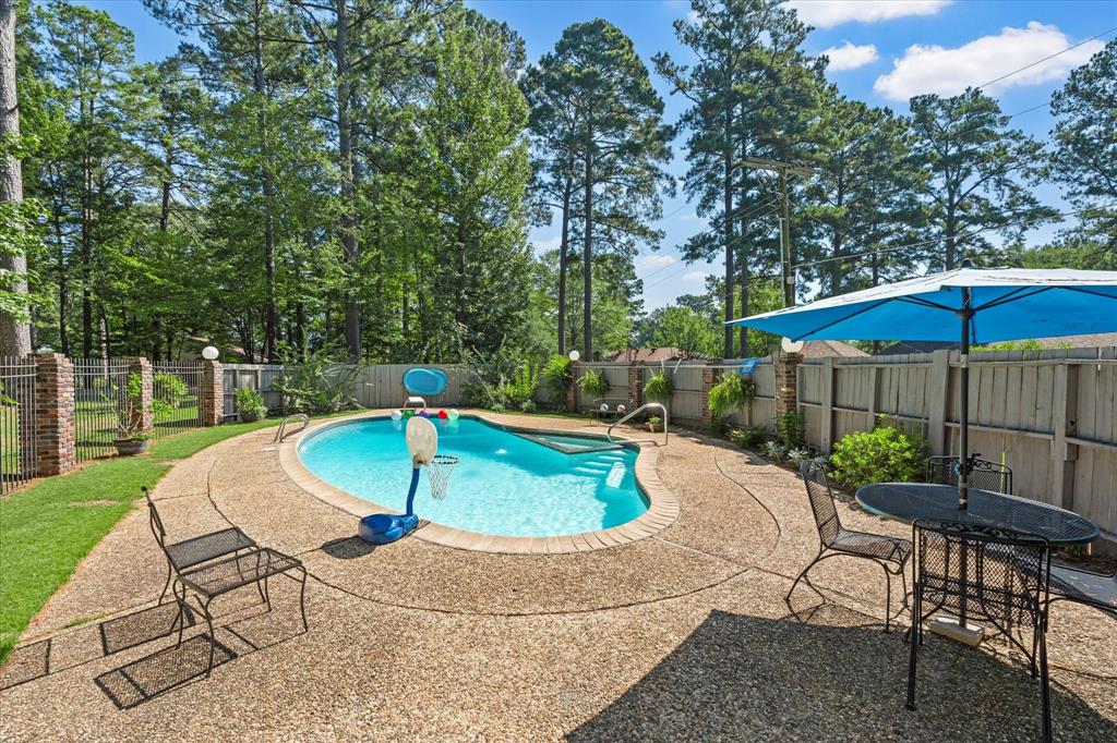 1200 North Acres Circle Springhill, LA 71075 - Photo 38 of 40 a swimming pool with outdoor seating yard and outdoor seating