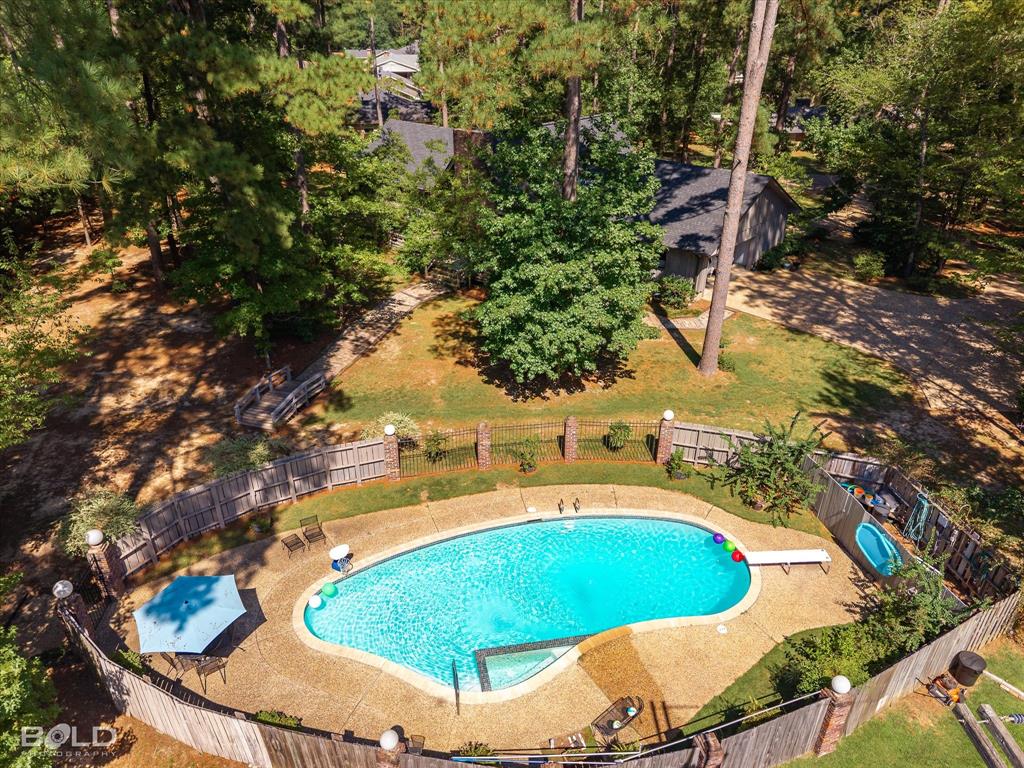 1200 North Acres Circle Springhill, LA 71075 - Photo 39 of 40 a view of a swimming pool with a yard