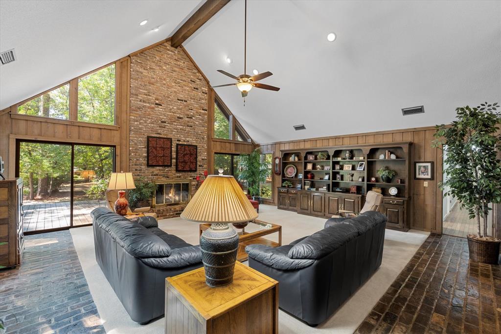 1200 North Acres Circle Springhill, LA 71075 - Photo 9 of 40 a living room with furniture a window and a flat screen tv
