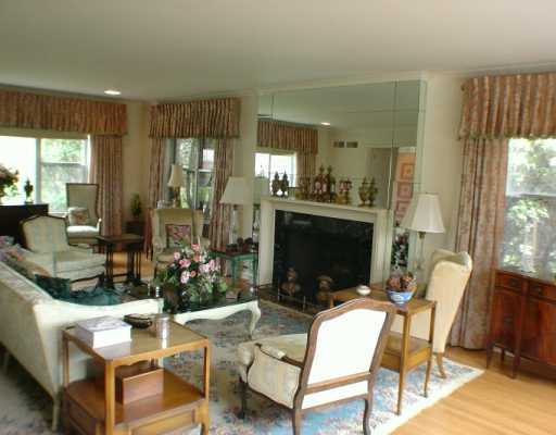 Undisclosed Address Greenwich, CT 06830 - Photo 3 of 7 a living room with fireplace furniture and a flat screen tv