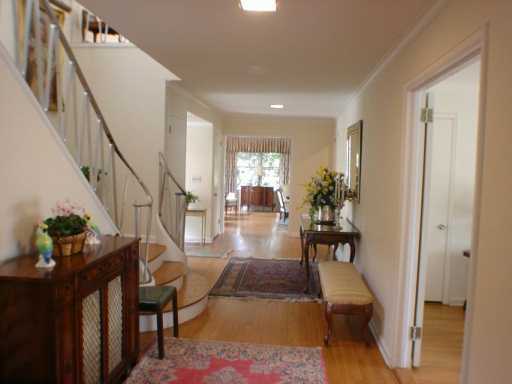 Undisclosed Address Greenwich, CT 06830 - Photo 5 of 7 a view of entryway and hall with wooden floor