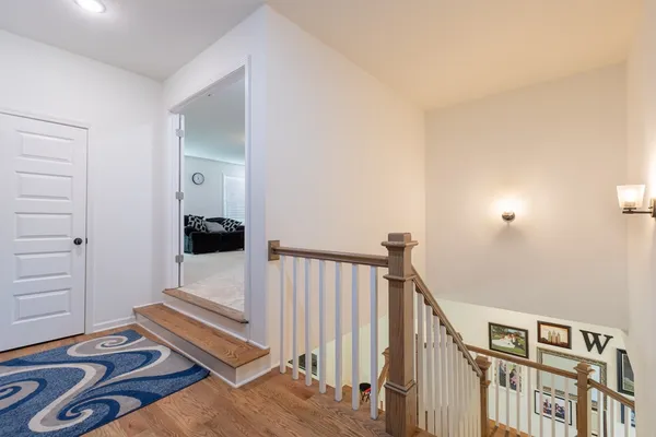a view of an empty room and wooden floor