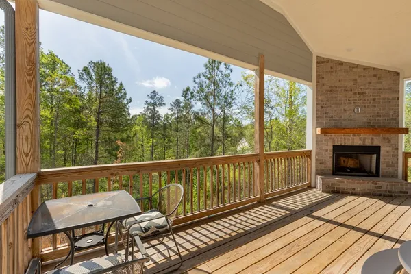 a balcony with table and chairs
