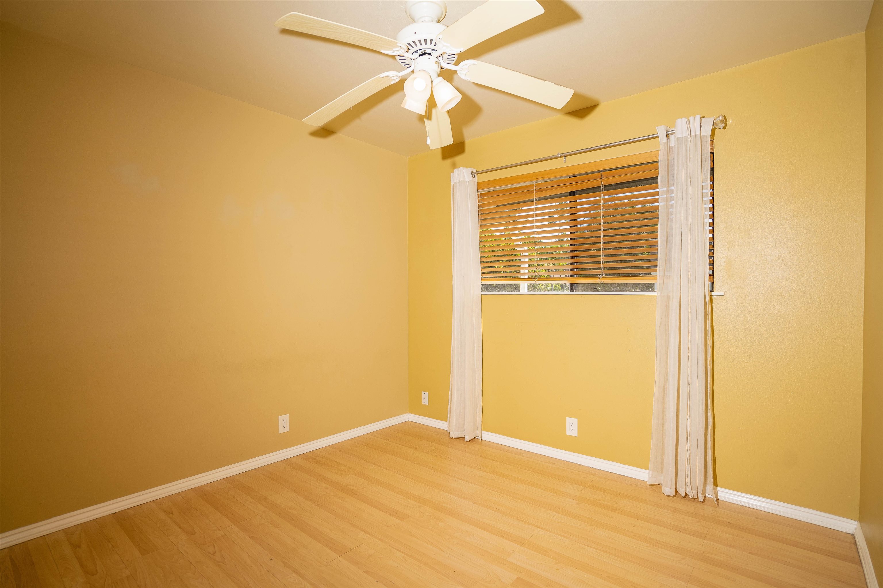 8 Laupapa Place Haiku, HI 96708 - Photo 10 of 30 an empty room with a window and a ceiling fan