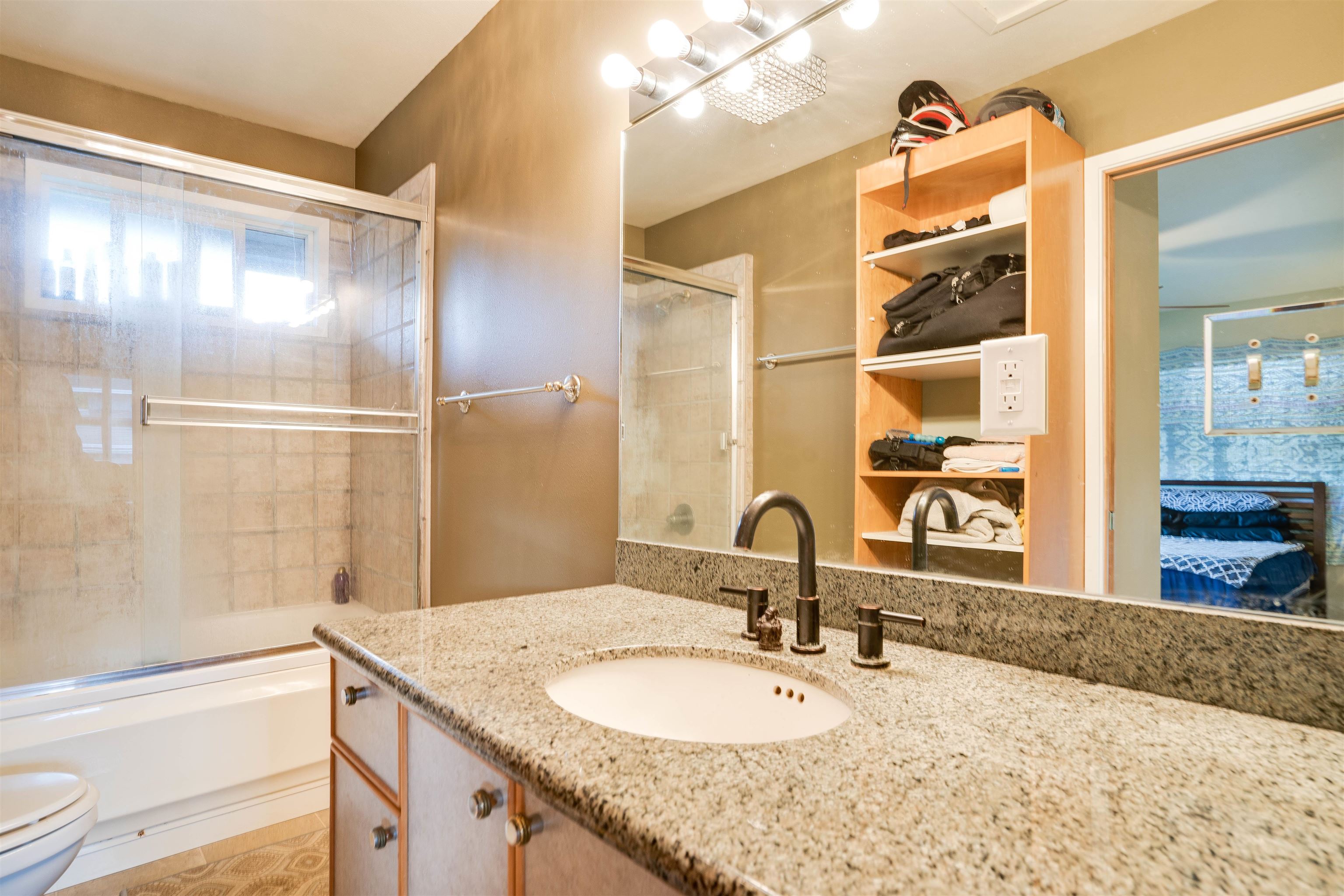 8 Laupapa Place Haiku, HI 96708 - Photo 24 of 30 a bathroom with a granite countertop sink and a mirror