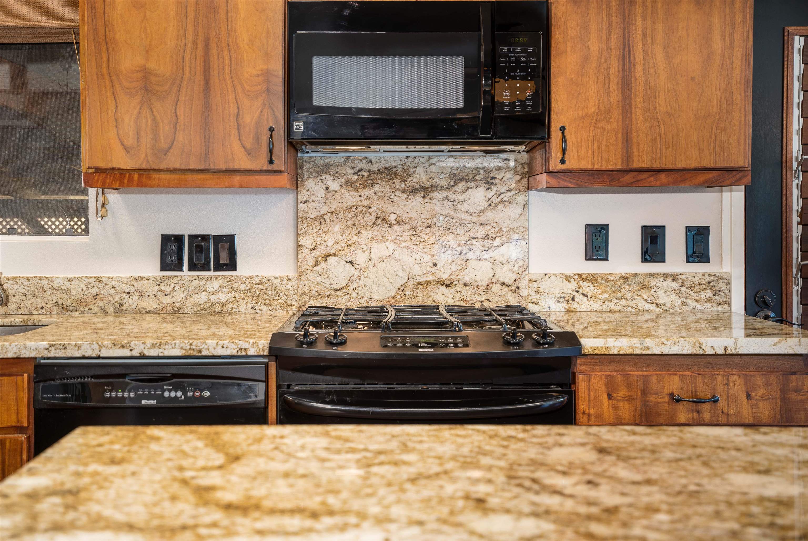 8 Laupapa Place Haiku, HI 96708 - Photo 5 of 30 a kitchen with stainless steel appliances granite countertop a stove and cabinets
