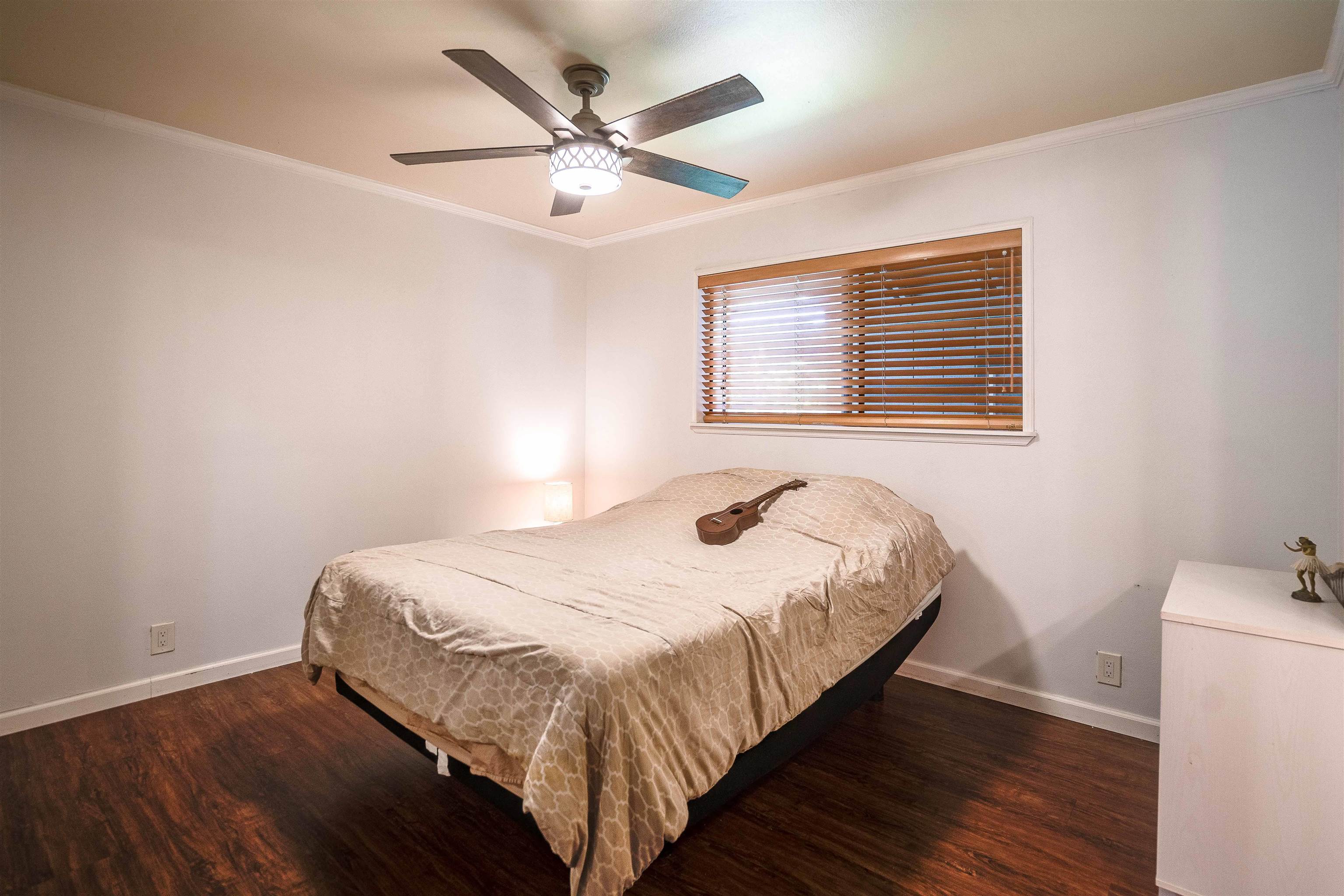 8 Laupapa Place Haiku, HI 96708 - Photo 7 of 30 a bedroom with a bed and wooden floor
