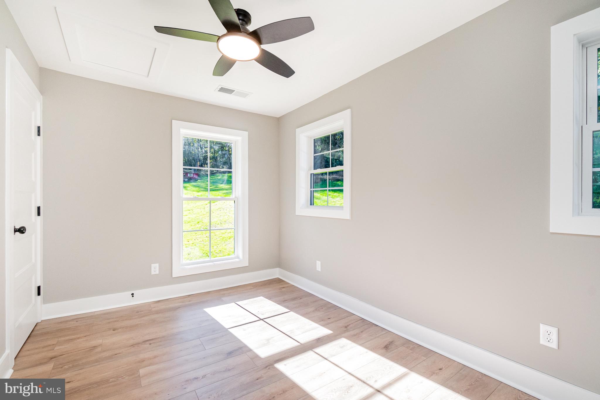 1803 Susquehanna Hall Road Whiteford, MD 21160 - Photo 30 of 49 a view of empty room with wooden floor and fan