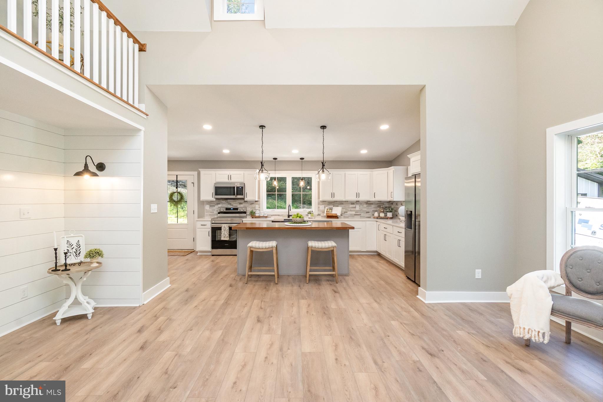 1803 Susquehanna Hall Road Whiteford, MD 21160 - Photo 10 of 49 a open kitchen with stainless steel appliances kitchen island hardwood floor and a sink