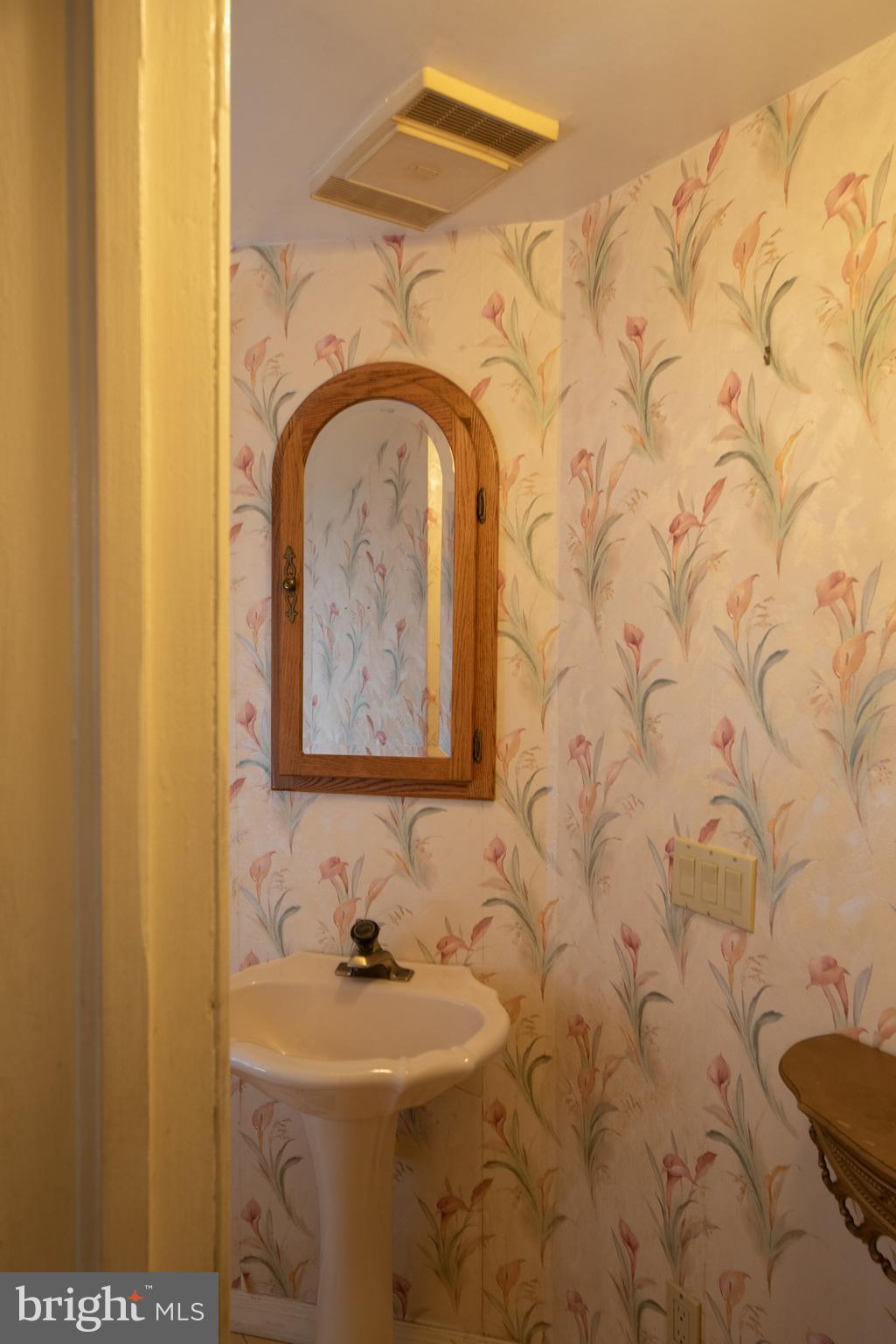 4712 Roland Avenue Baltimore, MD 21210 - Photo 22 of 66 half bath under main staircase