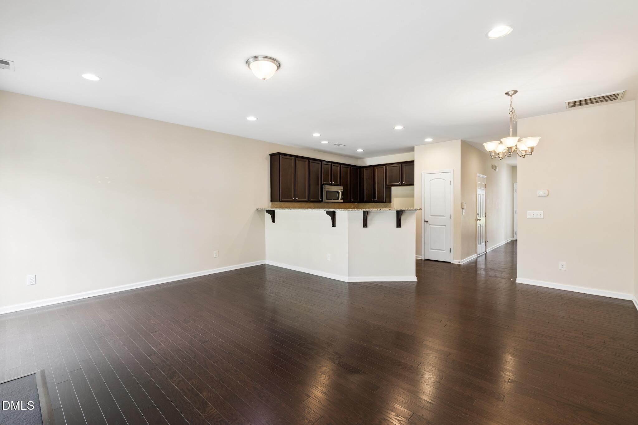 110 Marsena Lane Cary, NC 27513 - Photo 17 of 46 a view of a electric appliances in center and wooden floor