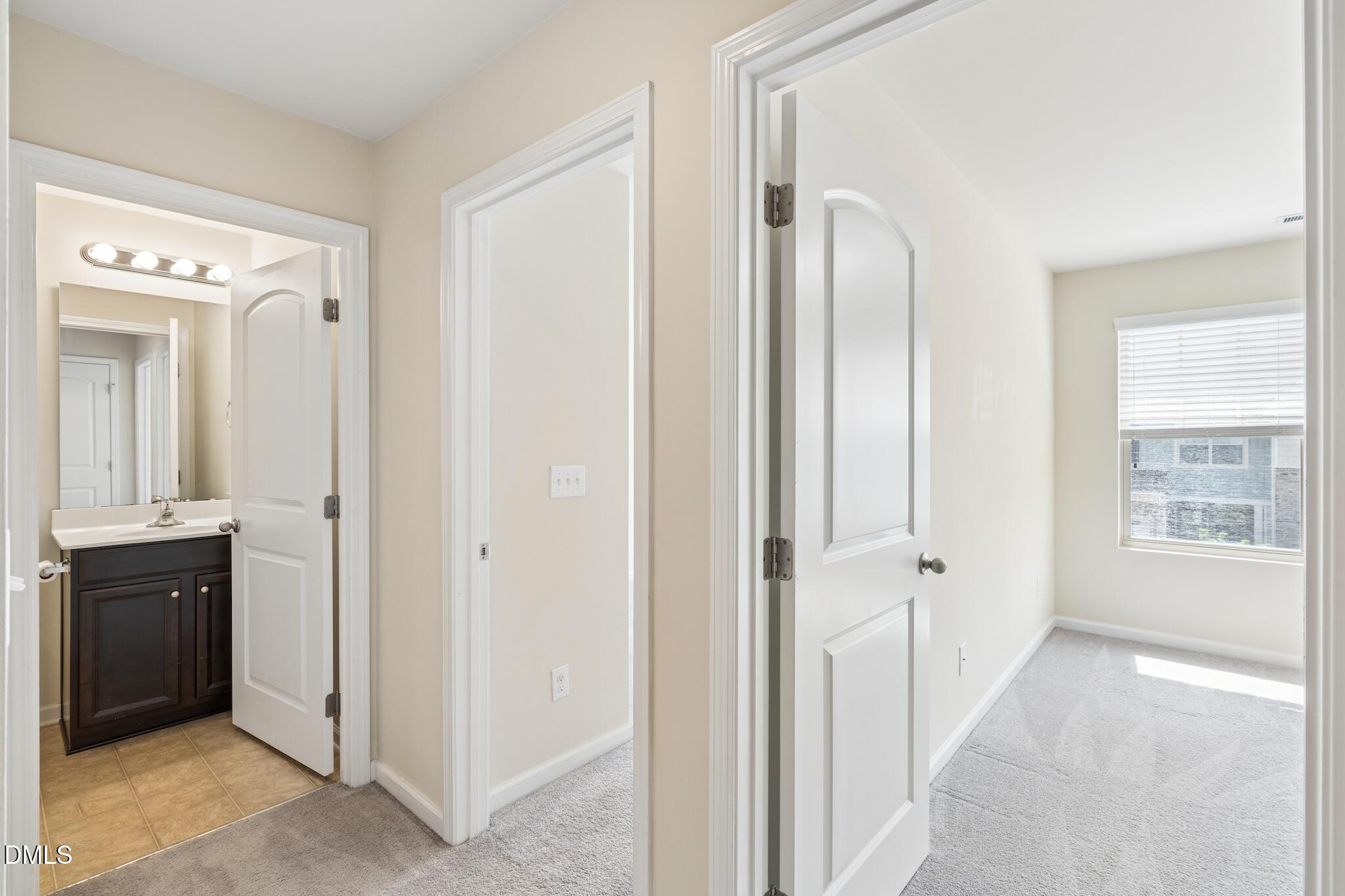 110 Marsena Lane Cary, NC 27513 - Photo 23 of 46 a view of a hallway to rooms and stairs