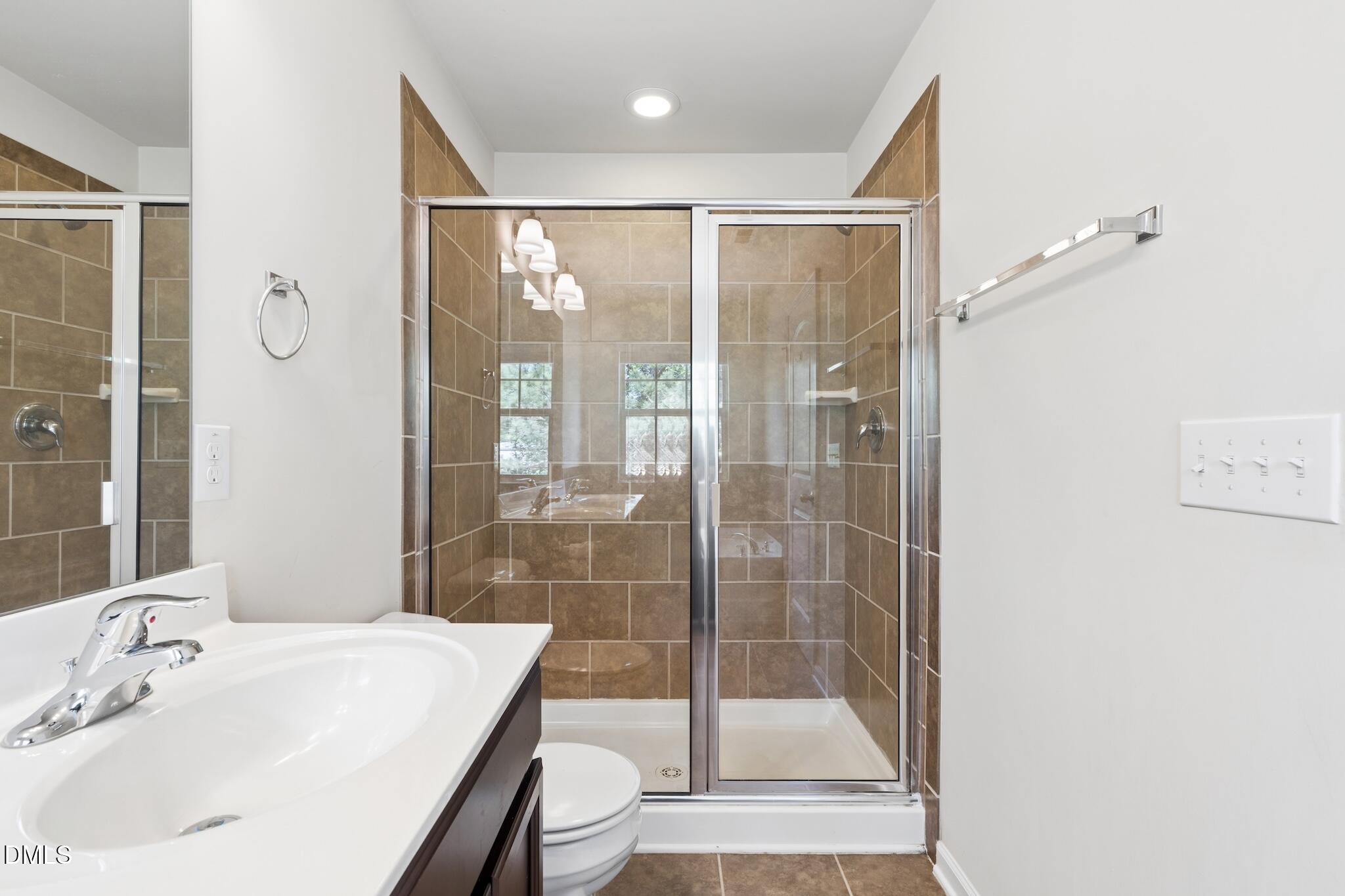 110 Marsena Lane Cary, NC 27513 - Photo 30 of 46 a bathroom with a bathtub shower sink and toilet