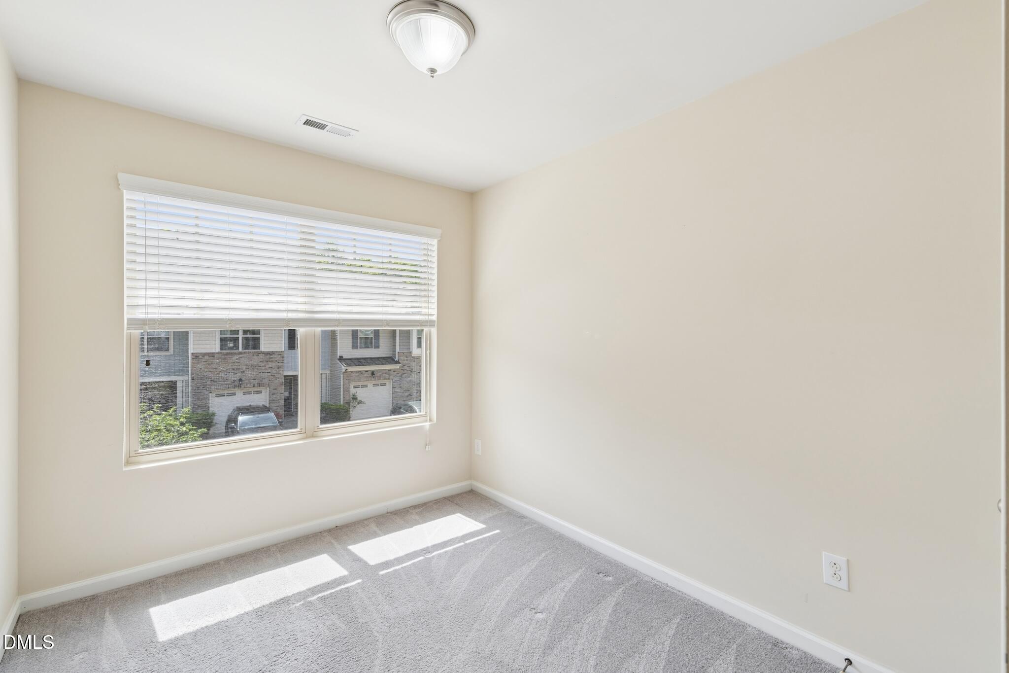 110 Marsena Lane Cary, NC 27513 - Photo 32 of 46 a view of an empty room with a window