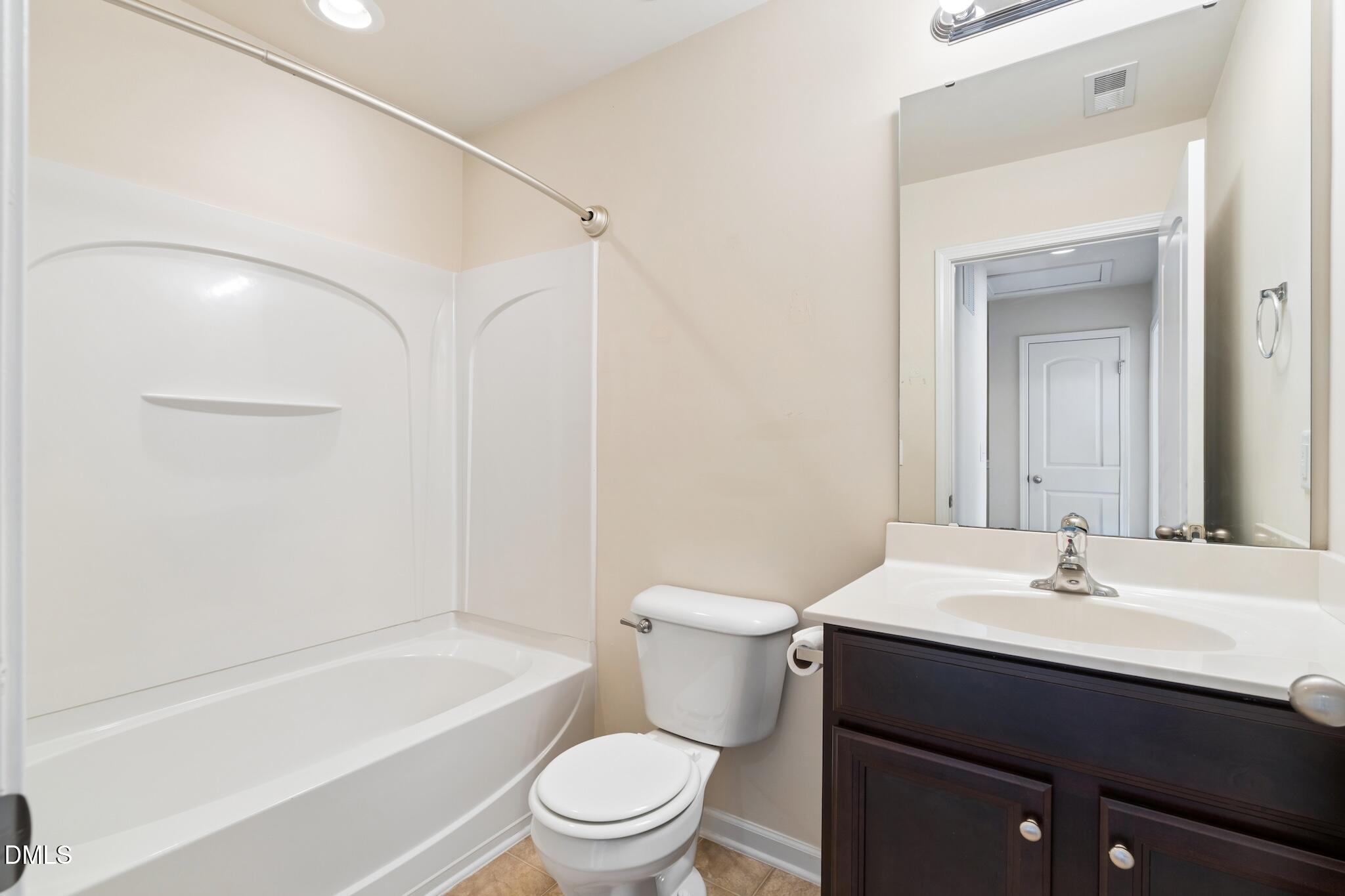 110 Marsena Lane Cary, NC 27513 - Photo 37 of 46 a bathroom with a sink a toilet and shower