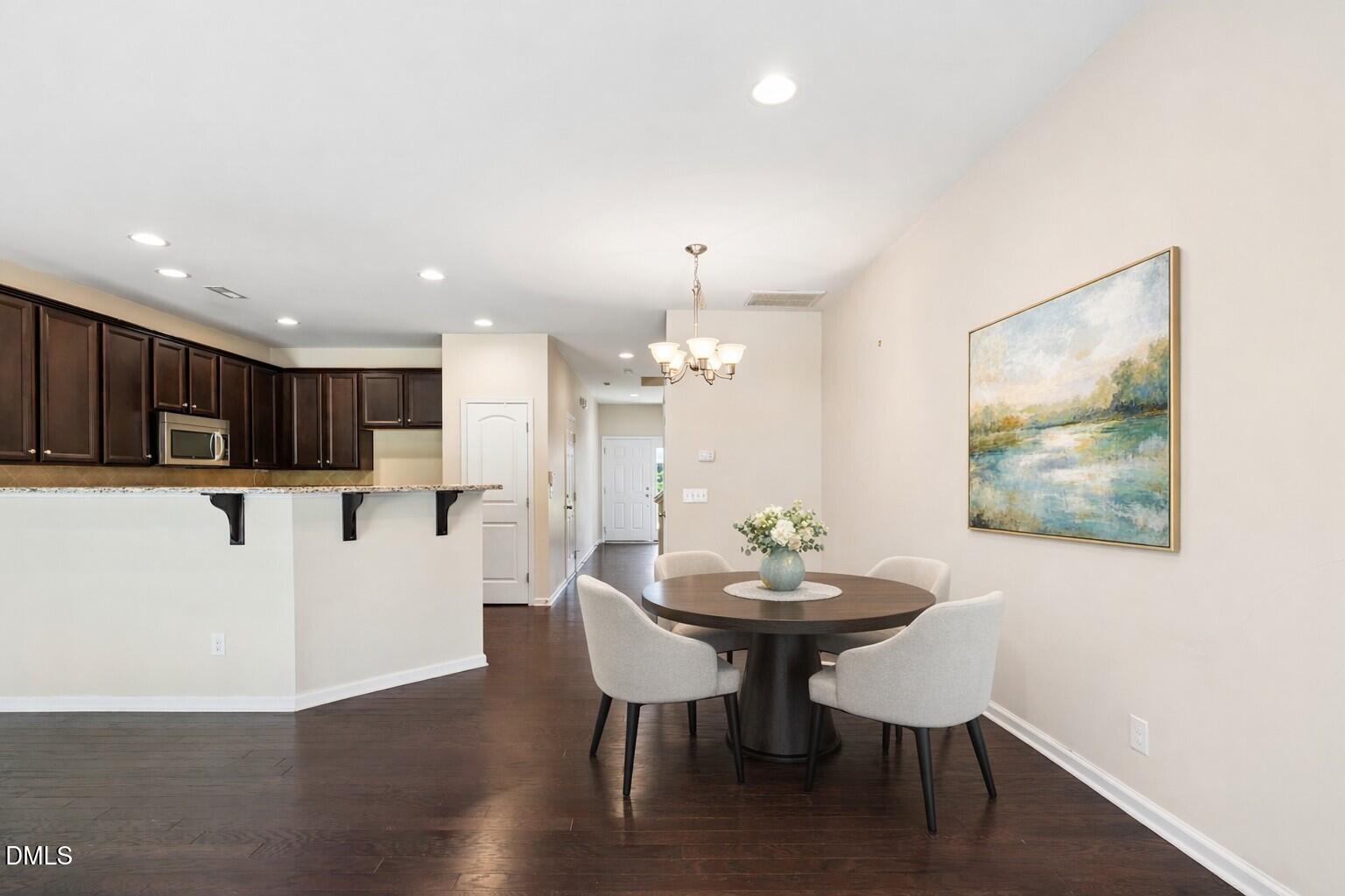 110 Marsena Lane Cary, NC 27513 - Photo 3 of 46 a view of a dining room with furniture and wooden floor