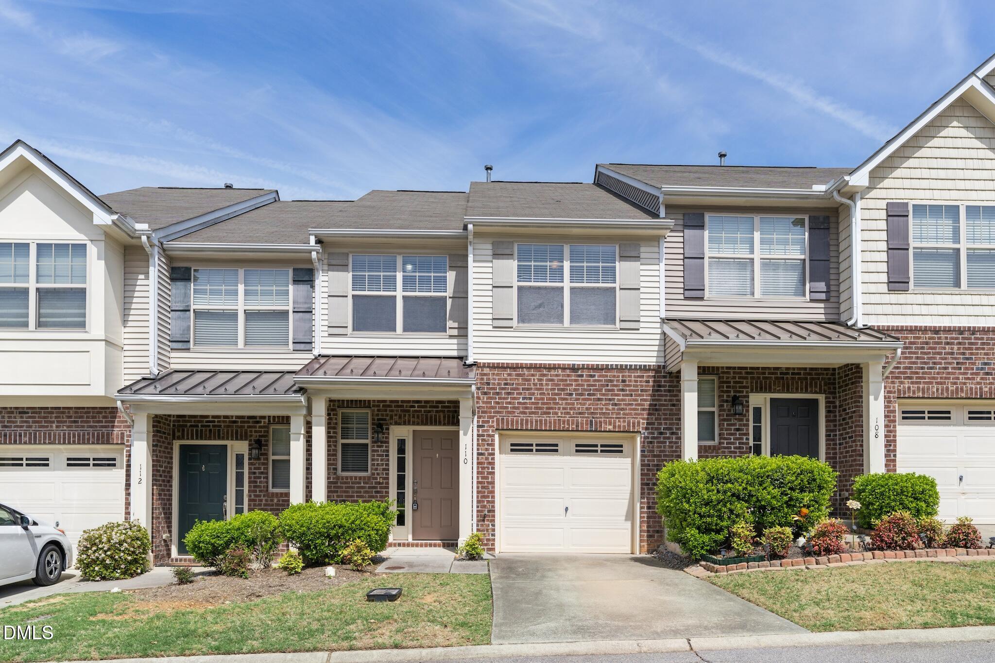 110 Marsena Lane Cary, NC 27513 - Photo 5 of 46 a front view of a house with yard and parking