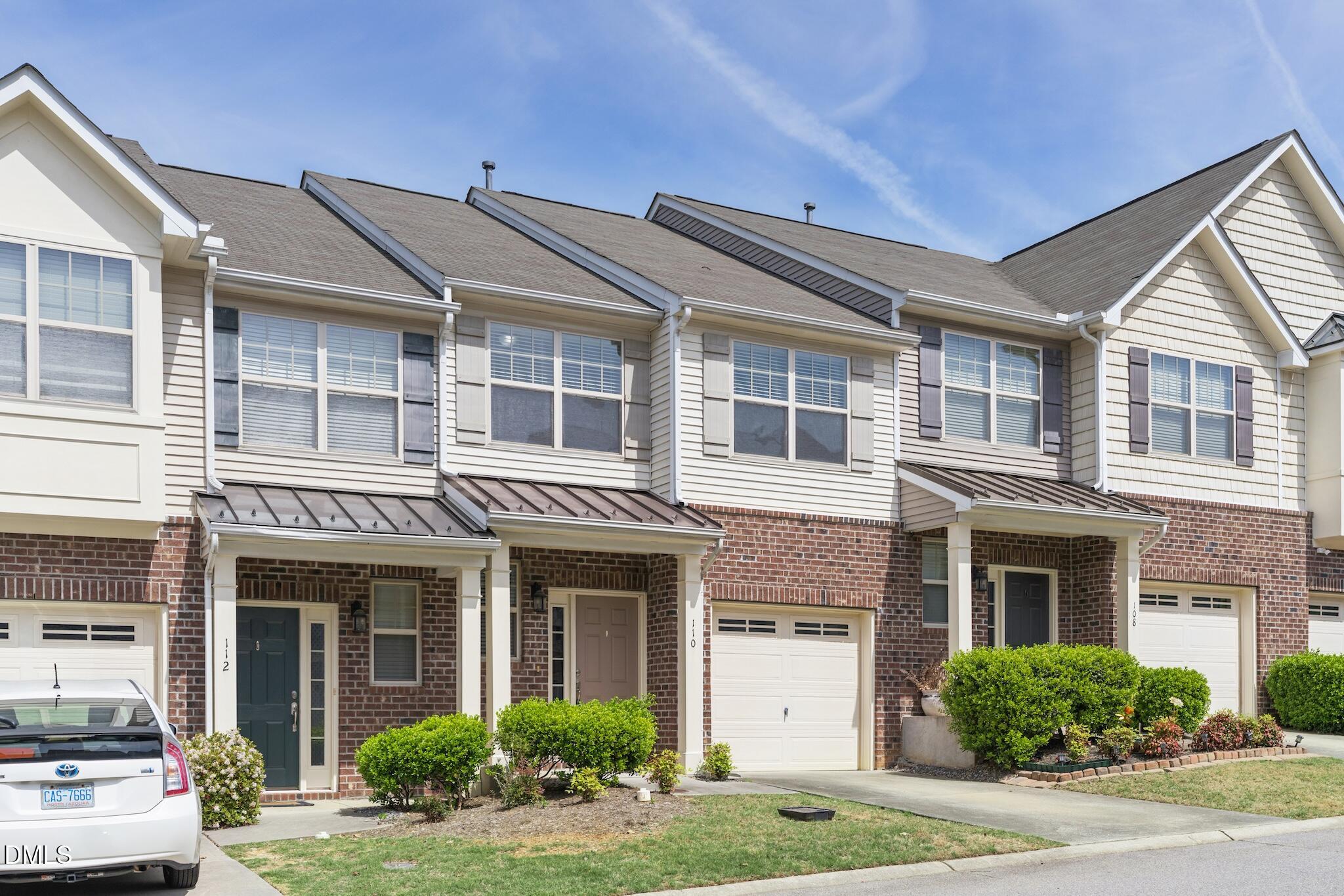 110 Marsena Lane Cary, NC 27513 - Photo 7 of 46 a front view of a house with a yard and plants