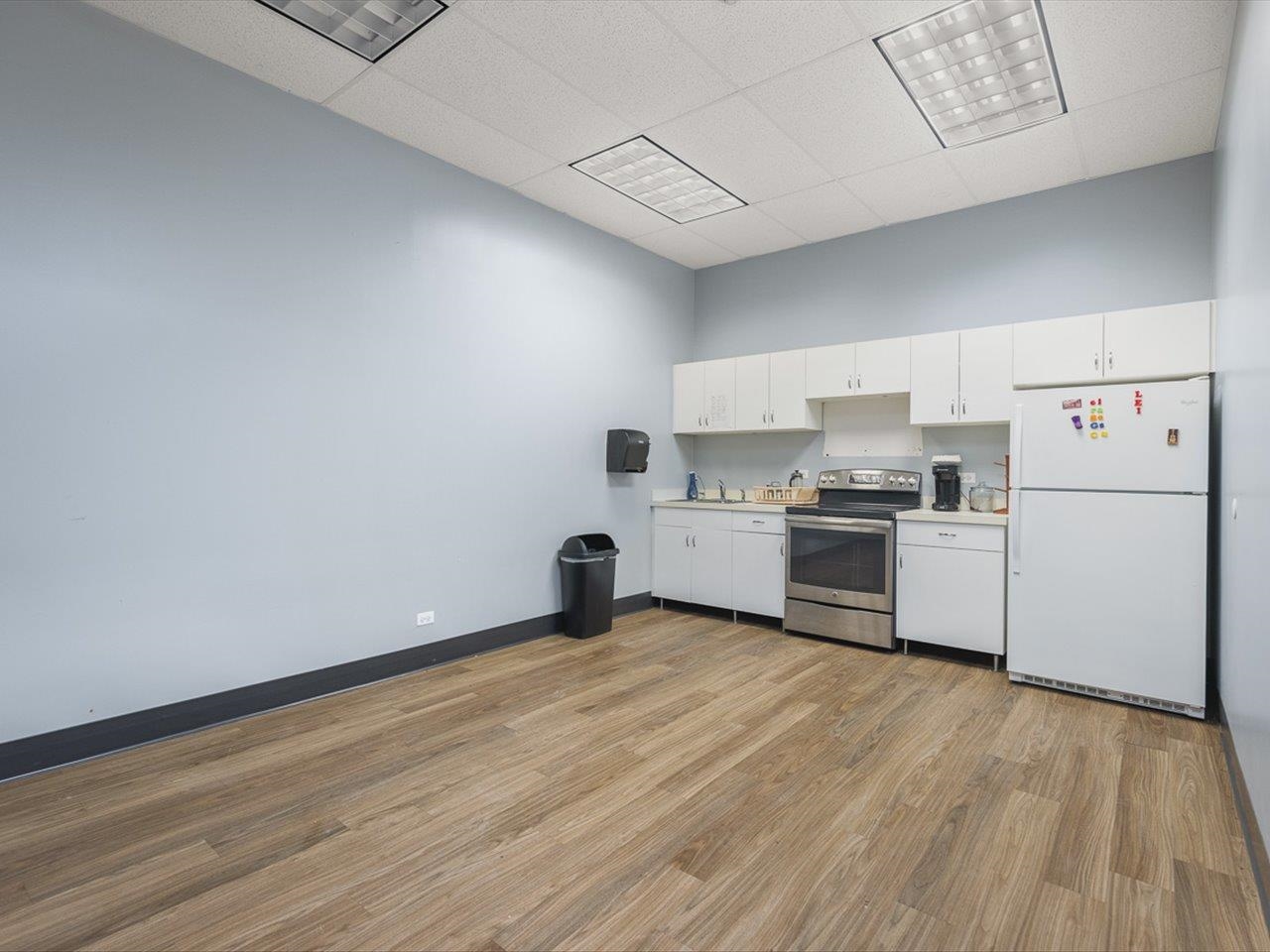 11635 Wange Road Capron, IL 61012 - Photo 23 of 57 a kitchen with stainless steel appliances a refrigerator sink and cabinets