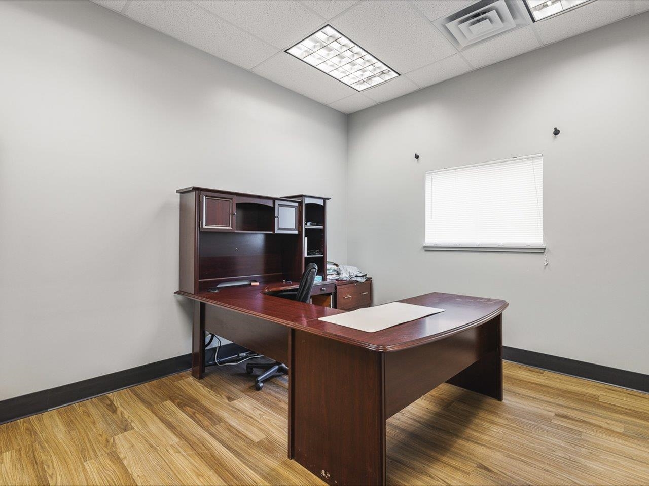 11635 Wange Road Capron, IL 61012 - Photo 27 of 57 a view of a workspace with furniture and a window