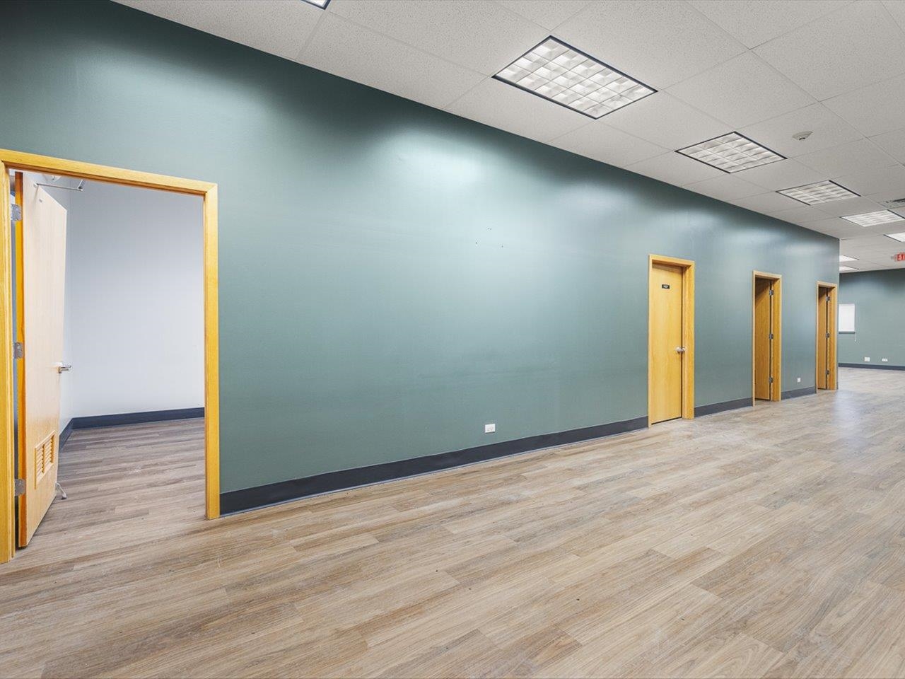 11635 Wange Road Capron, IL 61012 - Photo 28 of 57 an empty room with wooden floor and windows