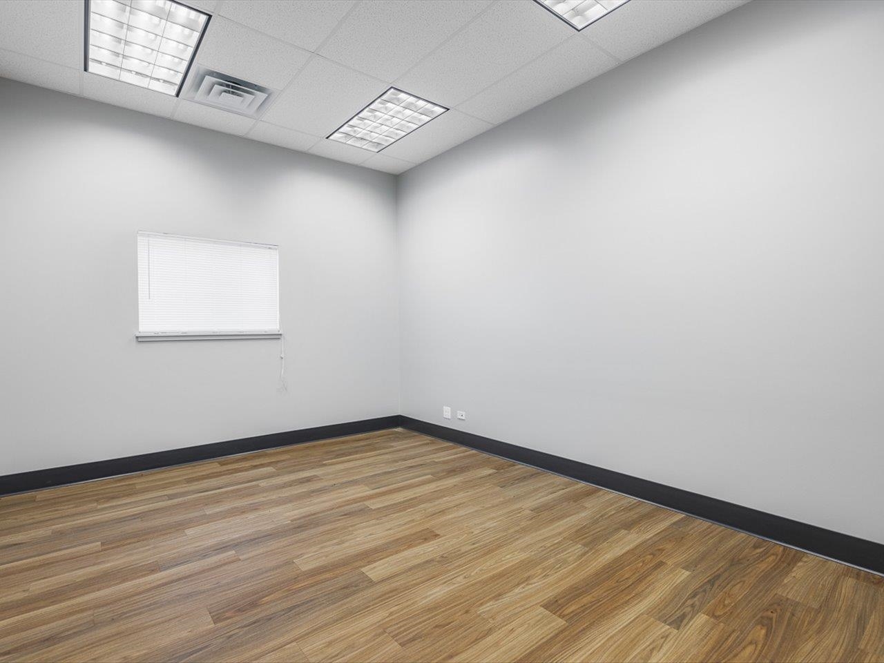 11635 Wange Road Capron, IL 61012 - Photo 28 of 57 an empty room with wooden floor and windows