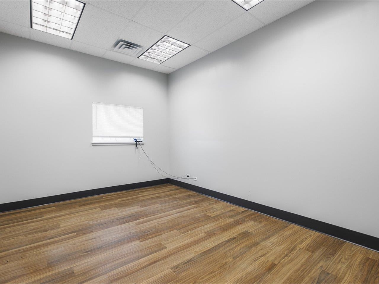 11635 Wange Road Capron, IL 61012 - Photo 56 of 57 a view of an empty room with wooden floor and a window