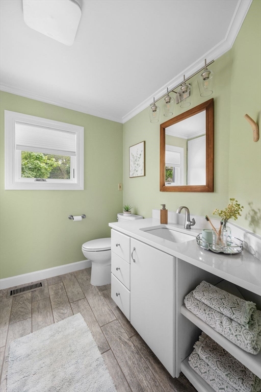 8 Baker Avenue Beverly, MA 01915 - Photo 21 of 40 a spacious bathroom with a toilet sink and mirror
