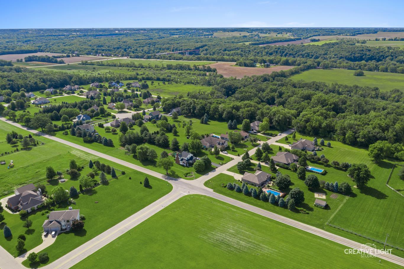 Lot #30 Mitchell Drive Plano, IL 60545 - Photo 8 of 12 a view of a city with lush green forest