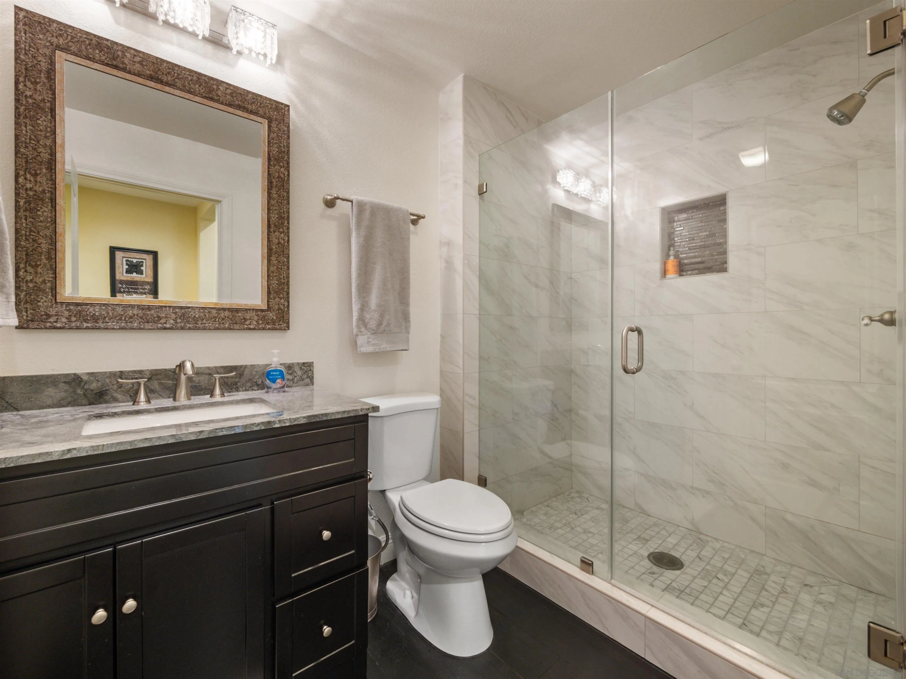 27751 Country Lane Road Laguna Niguel, CA 92677 - Photo 14 of 43 a bathroom with a granite countertop sink toilet a mirror and shower