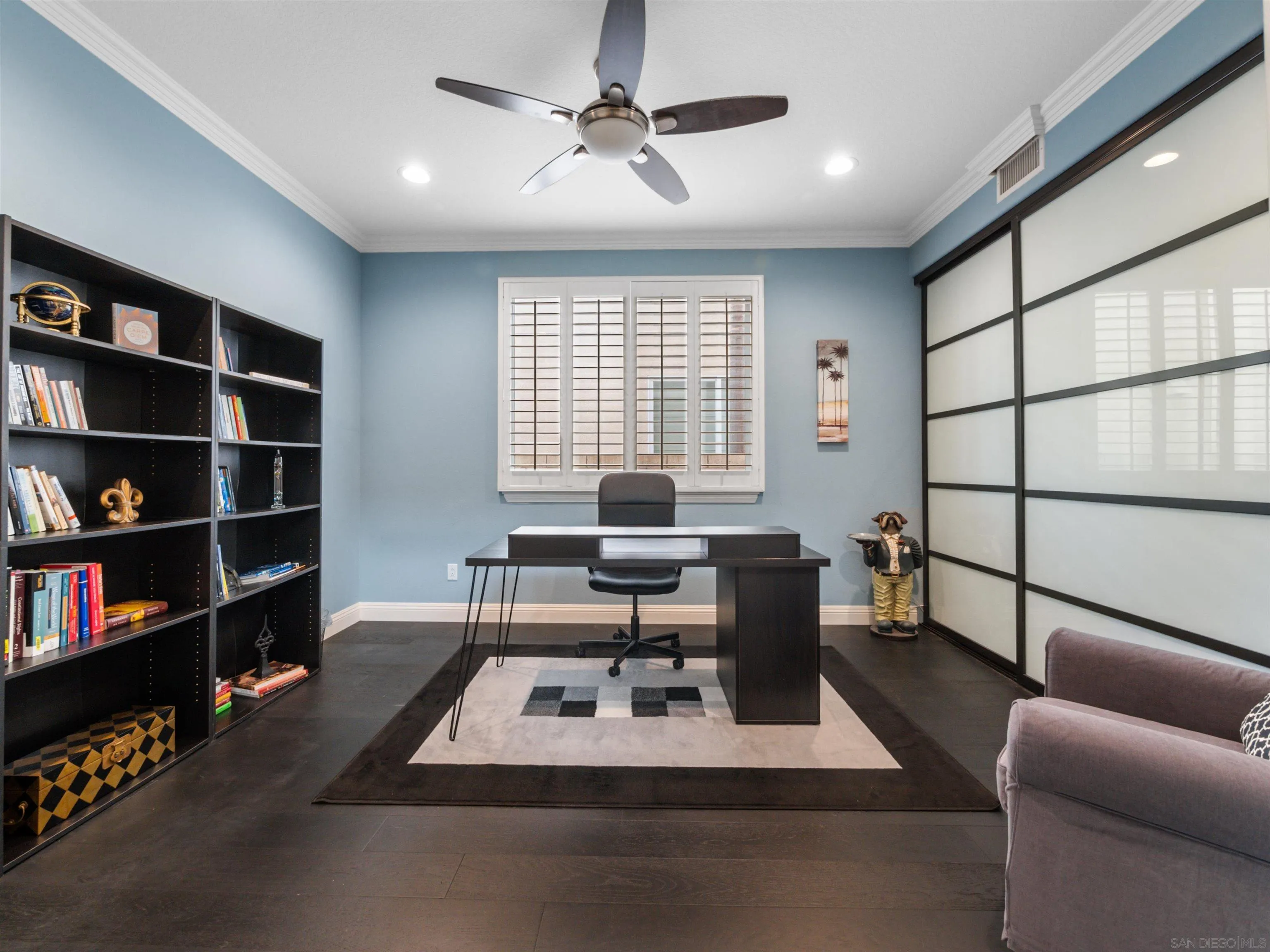 27751 Country Lane Road Laguna Niguel, CA 92677 - Photo 17 of 43 a living room with furniture a rug and a book shelf