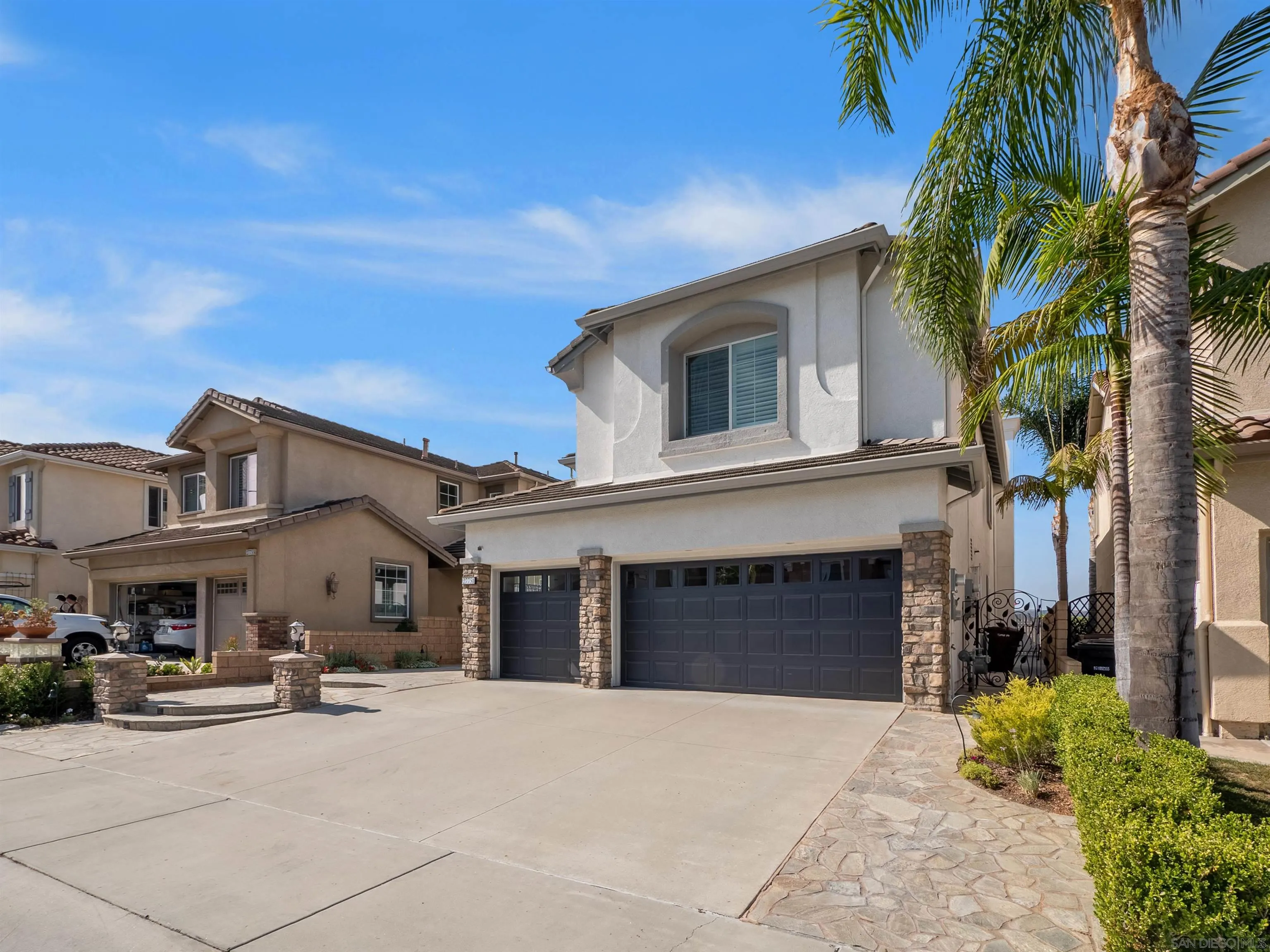 27751 Country Lane Road Laguna Niguel, CA 92677 - Photo 3 of 43 a front view of a house with a yard and garage