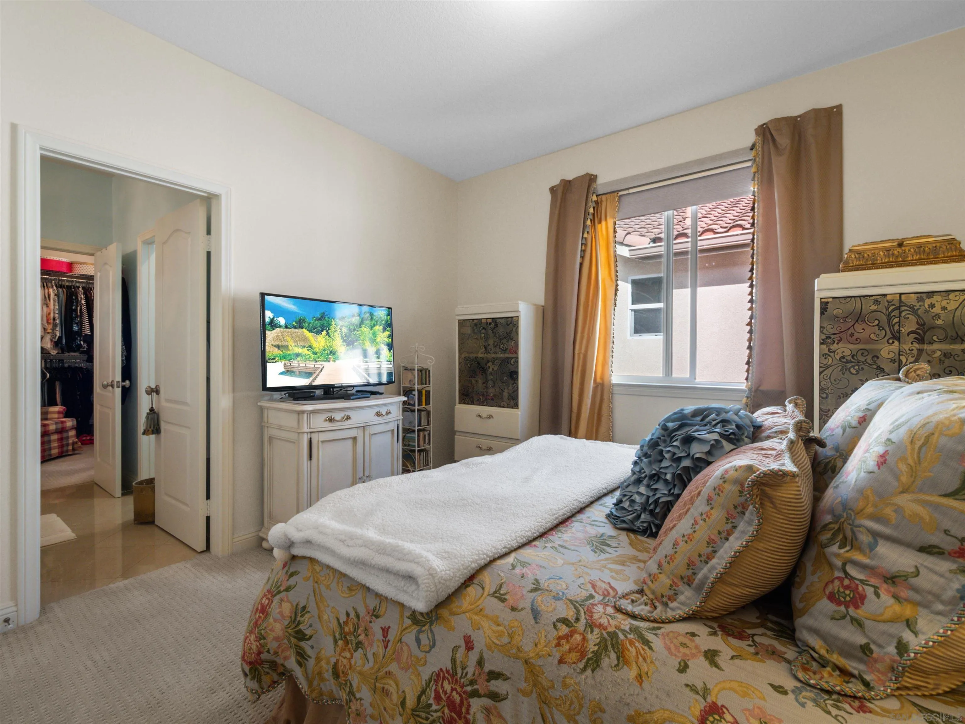 27751 Country Lane Road Laguna Niguel, CA 92677 - Photo 32 of 43 a bedroom with a bed and a flat screen tv