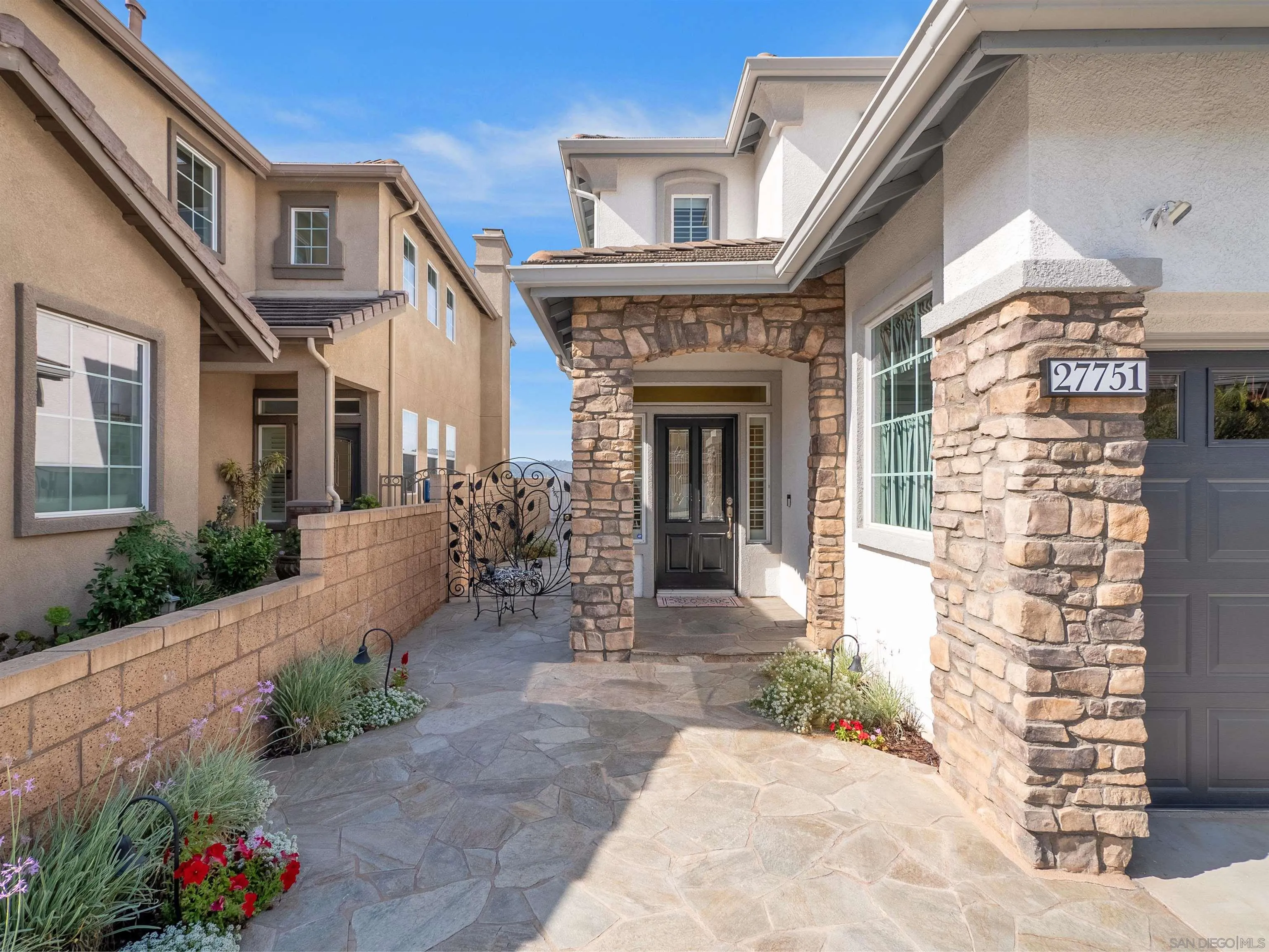 27751 Country Lane Road Laguna Niguel, CA 92677 - Photo 4 of 43 a front view of a house with a garden