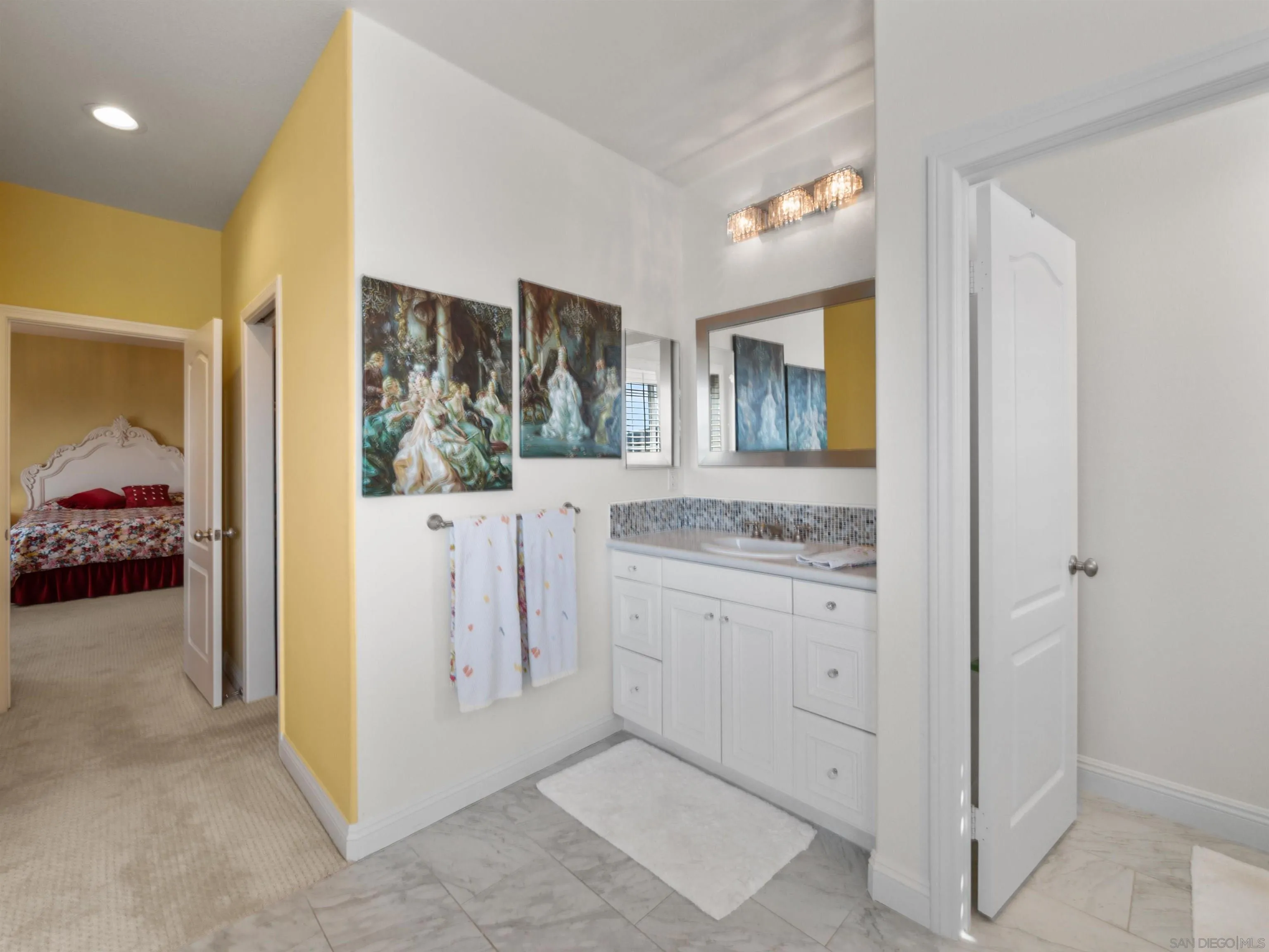 27751 Country Lane Road Laguna Niguel, CA 92677 - Photo 41 of 43 a en suite bathroom with a sink mirror and vanity