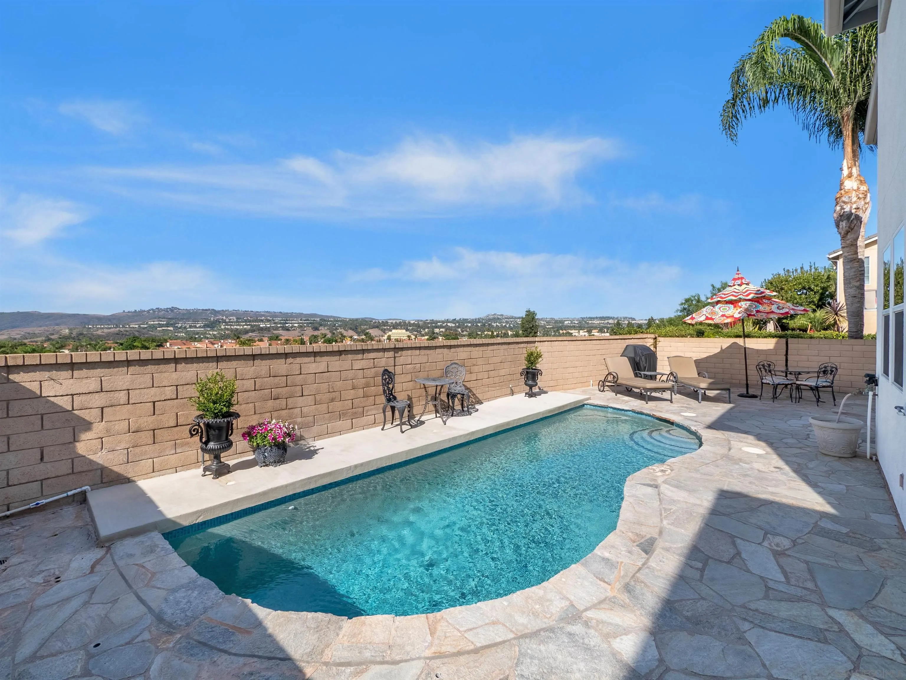 27751 Country Lane Road Laguna Niguel, CA 92677 - Photo 6 of 43 a view of a swimming pool and lounge chairs in the terrace