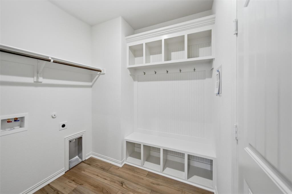 1228 Sabine River Lane Springtown, TX 76082 - Photo 13 of 30 Laundry area with light wood finished floors, gas dryer hookup, electric dryer hookup, and washer hookup