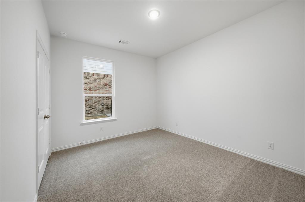 1228 Sabine River Lane Springtown, TX 76082 - Photo 25 of 30 Spare room with light carpet and baseboards