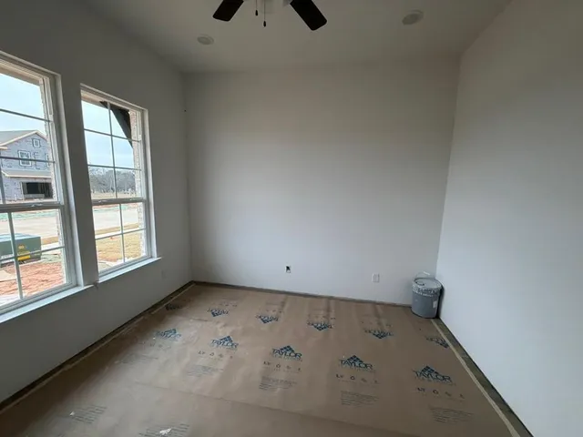 an empty room with windows