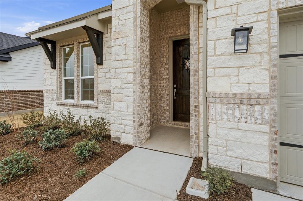 1228 Sabine River Lane Springtown, TX 76082 - Photo 6 of 30 View of exterior entry with stone siding