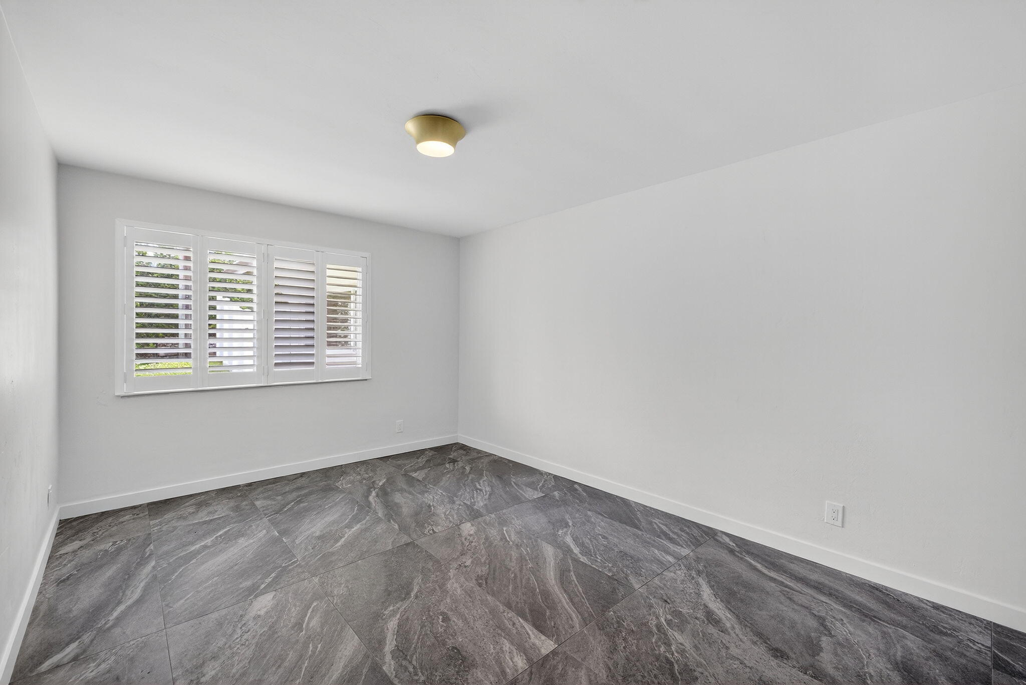 4442 Sea Grape Drive, Unit 1NORTH Lauderdale-by-the-Sea, FL 33308 - Photo 20 of 35 an empty room with windows