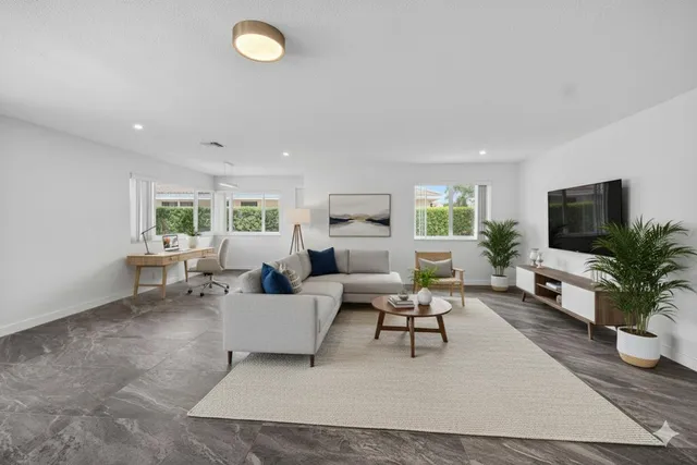 an aerial view of residential houses with outdoor space and street view