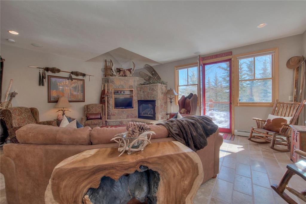 334 D Streamside Lane Frisco, CO 80443 - Photo 2 of 35 a living room with furniture fireplace and a large window