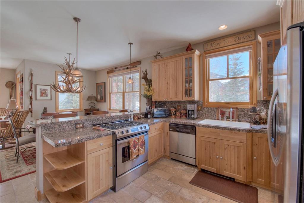 334 D Streamside Lane Frisco, CO 80443 - Photo 11 of 35 a kitchen that has a stove a sink and a stove