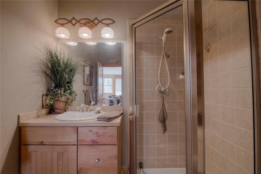 334 D Streamside Lane Frisco, CO 80443 - Photo 15 of 35 a bathroom with a sink a light fixture and a mirror