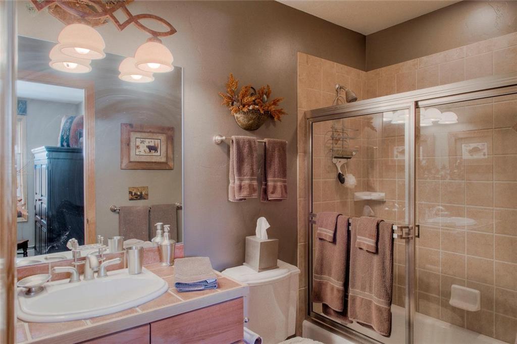 334 D Streamside Lane Frisco, CO 80443 - Photo 27 of 35 a bathroom with a sink toilet and shower