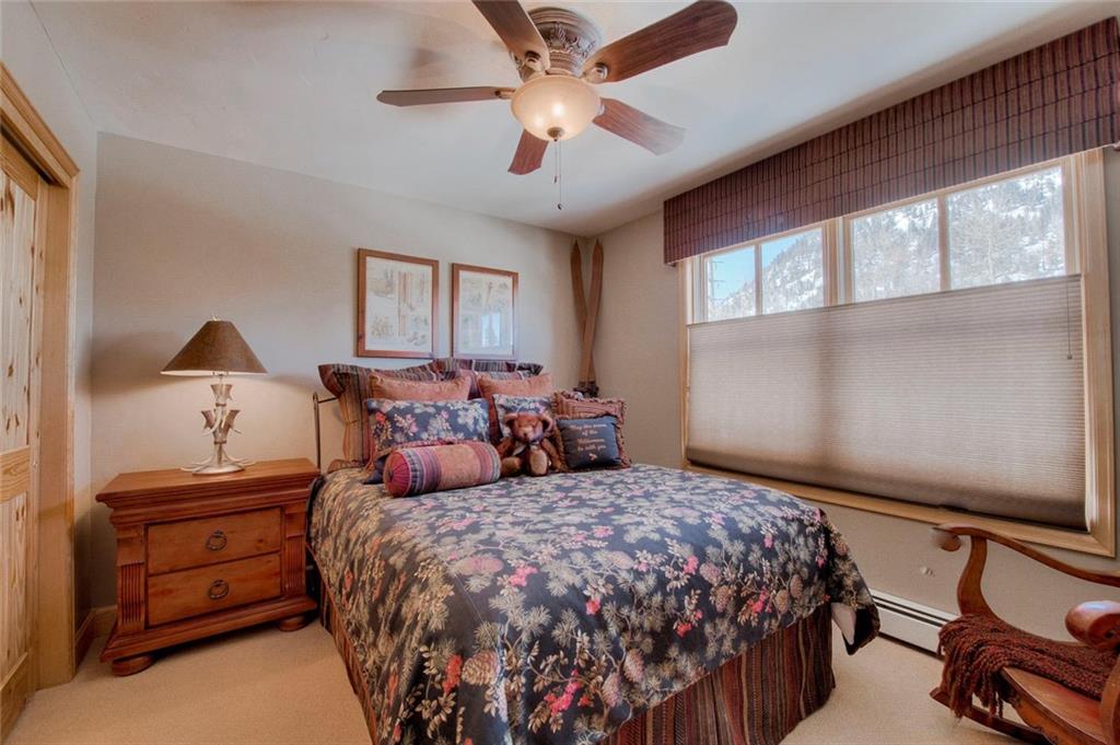 334 D Streamside Lane Frisco, CO 80443 - Photo 28 of 35 a bedroom with bed and window