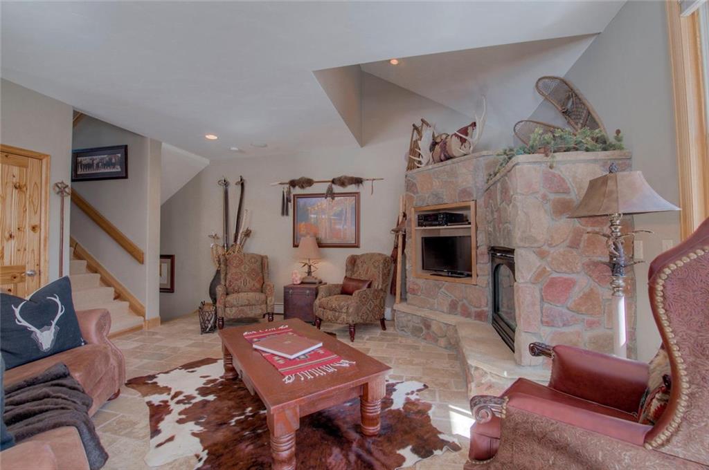 334 D Streamside Lane Frisco, CO 80443 - Photo 4 of 35 a living room with furniture and a fireplace